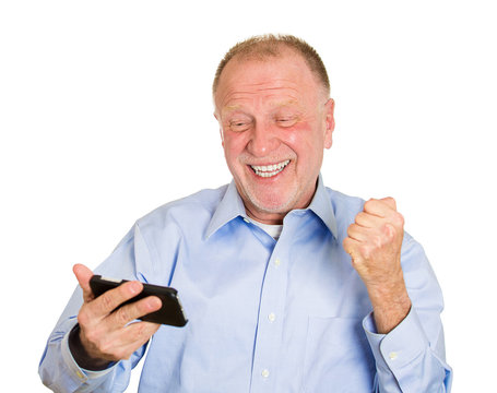 Senior man receiving good news on mobile phone, email
