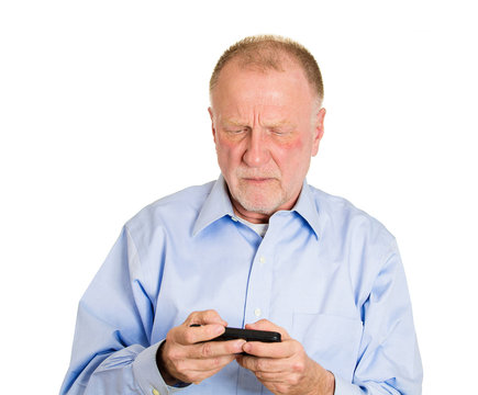 Senior elderly man reading bad text or email on mobile phone 