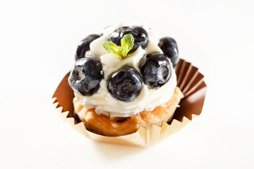 Blueberry tart on white background