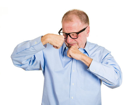 Is it me that stinks? Senior man smells armpit white background 