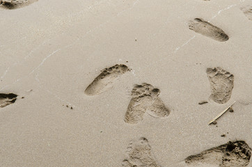 Close up of footprints on the beach sand