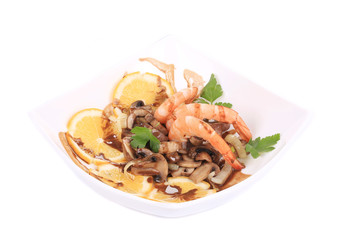Shrimp salad with mushrooms and lemons.