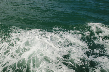 Boat wake on the water near the boat
