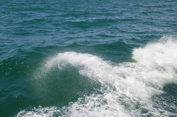 Boat wake on the water near the boat