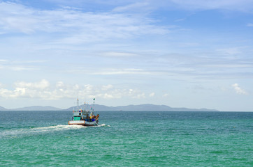 Wooden fishing boat out to sea