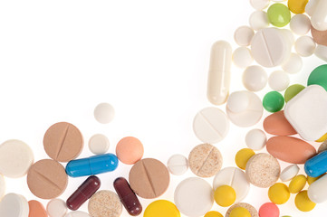 Stack of different pills isolated on white background