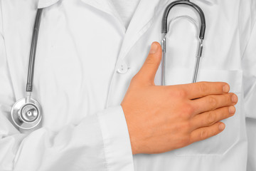 Doctor is stroking his pocket with money