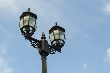 Fototapeta na wymiar the vintage lamp with cloud blue sky