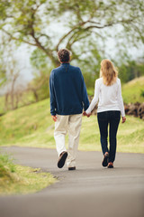 Happy loving middle aged couple walking