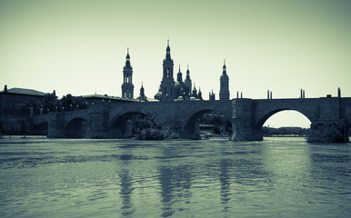 Stone bridge and Cathedral.   Imitation of vintage image