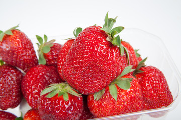 fresh strawberries in the plastic tray