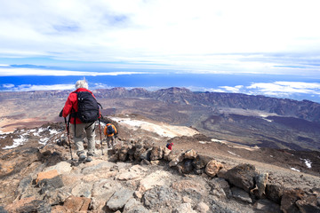 Man at mountain landscape near volcano Teide descending
