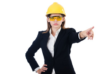 Pretty businesswoman with hard hat pressing  virtual buttons  is