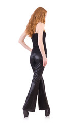 Fototapeta premium Redhead woman in black bell bottom pants on white