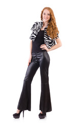 Redhead woman in black bell bottom pants on white