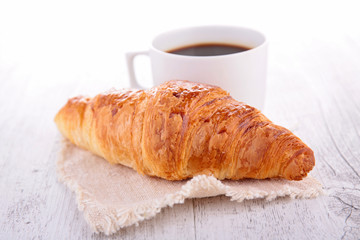 croissant and coffee cup