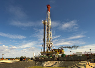 View of the land rig across the sump pit