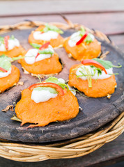 Baked curried fish paste on earthenware