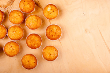 Close-up of cupcakes on wooden board.