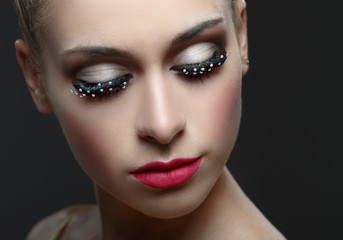 Macro shot of woman's beautiful eye with fashion eyelashes.