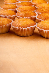 Close-up of cupcakes on wooden board.