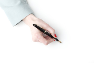 Close-up of businesswoman with fountain pen