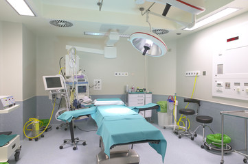 Surgery room interior with medical equipment.