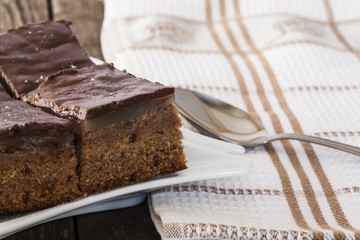 chocolate tarts on a plate on a wooden table