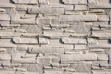 White cladding tiles imitating stones