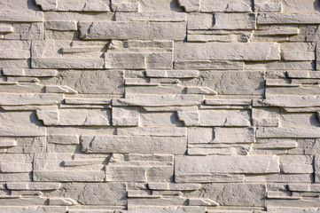 White cladding tiles imitating stones