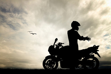 Plakat motorcyclist at sunset