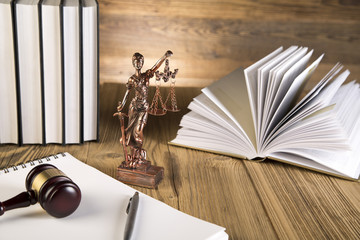 Lady of justice, wooden & gold gavel and books on wooden table - 63665605
