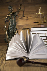 Naklejka premium Lady of justice, wooden & gold gavel and books on wooden table