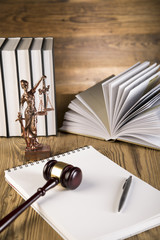 Lady of justice, wooden & gold gavel and books on wooden table - 63666003