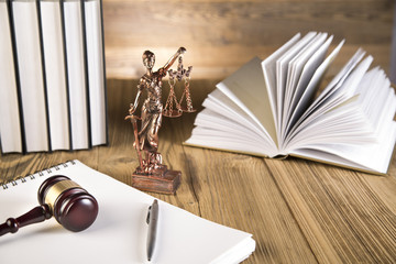 Lady of justice, wooden & gold gavel and books on wooden table - 63666063