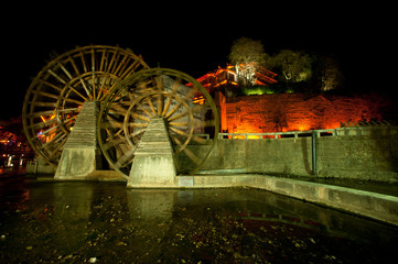 Water wheel ,landmark of Lijiang Dayan old town at night.