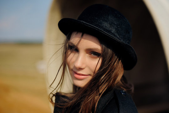 portrait of a beautiful girl in a hat with a smile
