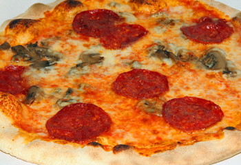 pizza with pepperoni and mushrooms and mozzarella