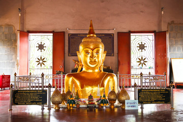 Golden buddha emerging from ground in Phuket Thailand