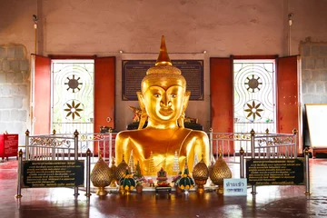 Papier Peint Lavable Bouddha Golden buddha emerging from ground in Phuket Thailand