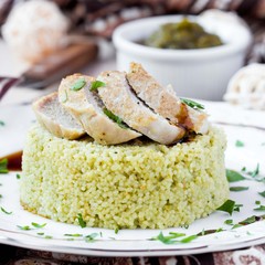 Couscous with pesto sauce, fried sliced pork, tasty dish