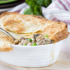 Meat pie with stew of chicken, mushrooms, peas, puff pastry