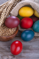 Painted eggs in a linen sack for the celebration of Easter