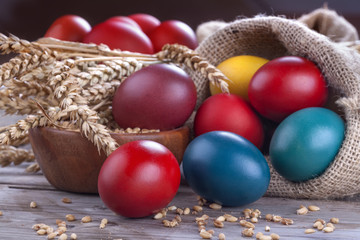 Painted eggs in a linen sack for the celebration of Easter