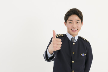 Cheerful airline pilot with thumb up © blueperfume