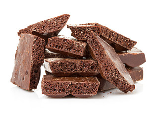 Closeup detail of chocolate parts on white background.