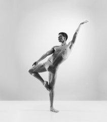 Sporty and athletic ballet dance. Black and white image.