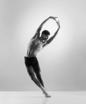 A sporty and athletic ballet dancer. Black and white image.