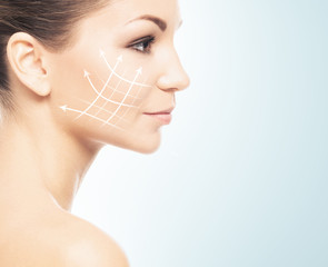 Young, beautiful and healthy girl with arrows on her face