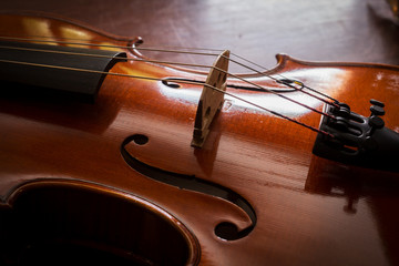 Fototapeta premium Still life violin on wood table.